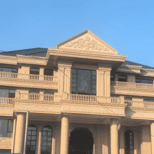 六盘水黄金麻别墅外墙干挂石材效果示例